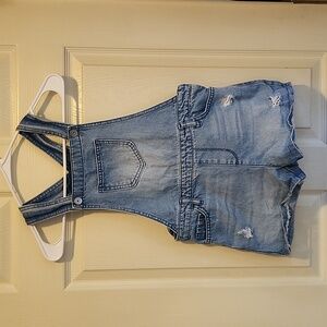 Stressed overall shorts